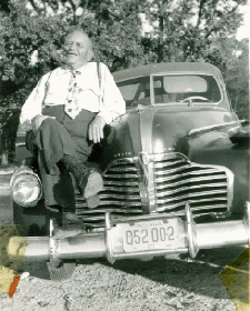 William Louis Johnsen sitting on his Buick in 1947
